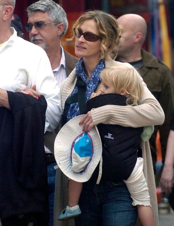 Julia Roberts holds daughter Hazel in carrier across her chest