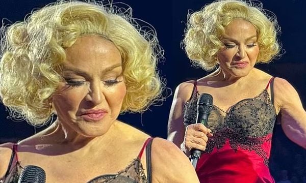 Madonna Takes The Stage Showing Her Muscles In A Skimpy Red Negligee