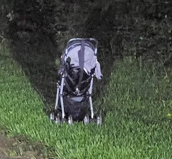 Abandoned stroller on the side of the road